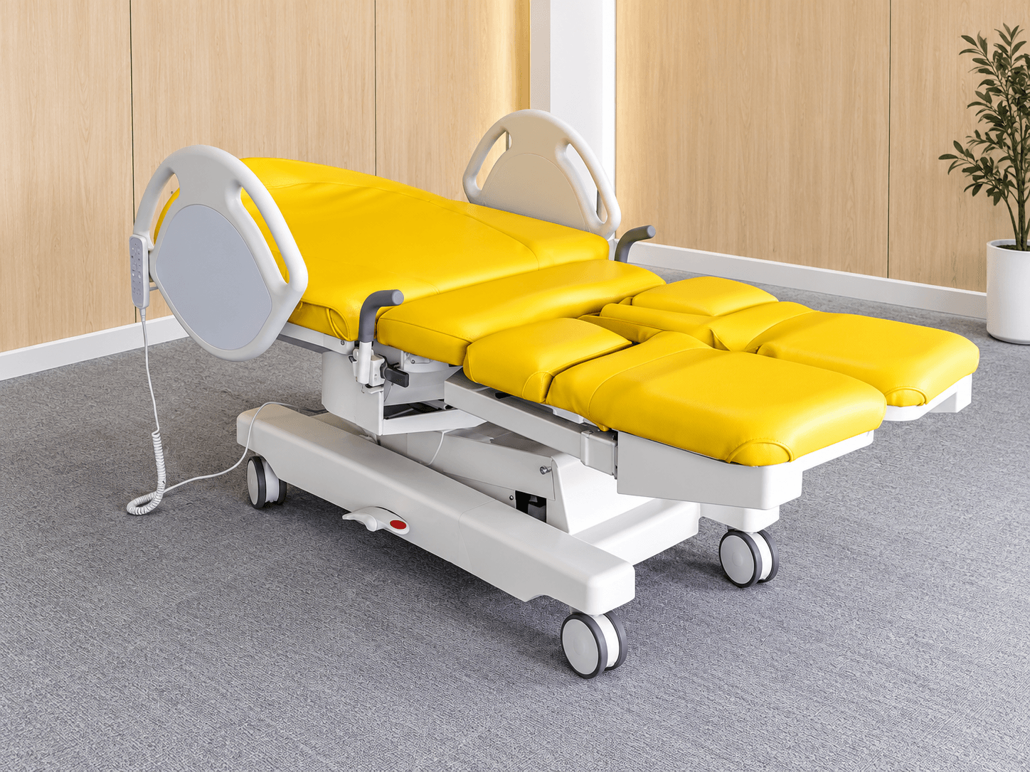 Yellow segmented maternity bed in a showroom.