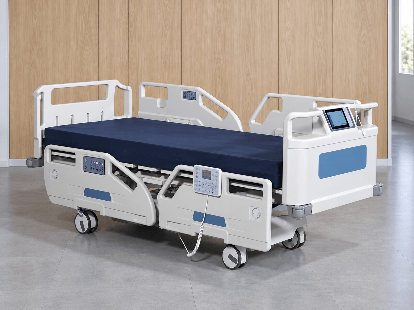 White electric hospital bed with a navy mattress, side controls, and footboard screen.