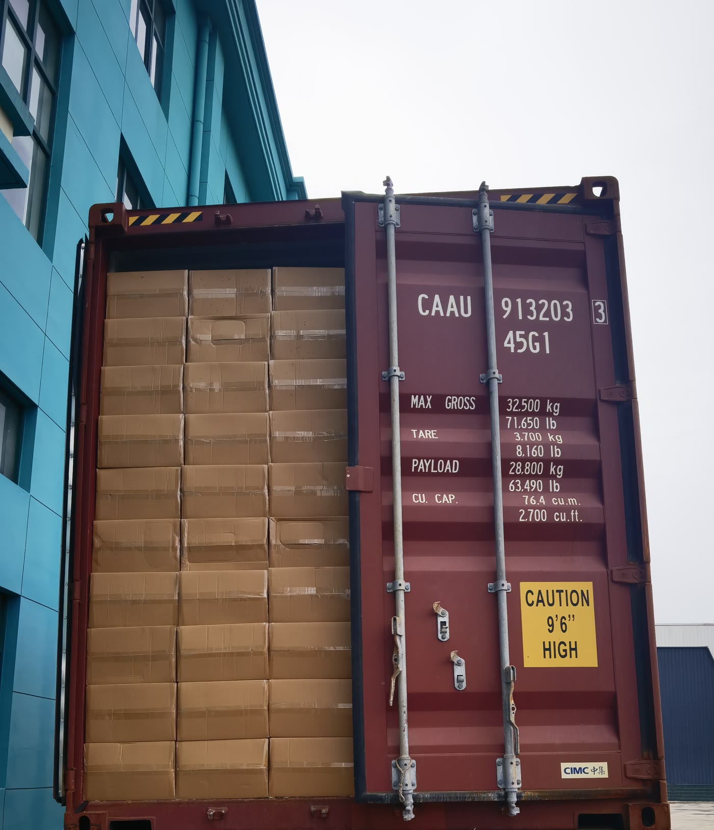 Container three: cartons loaded behind a half-closed door