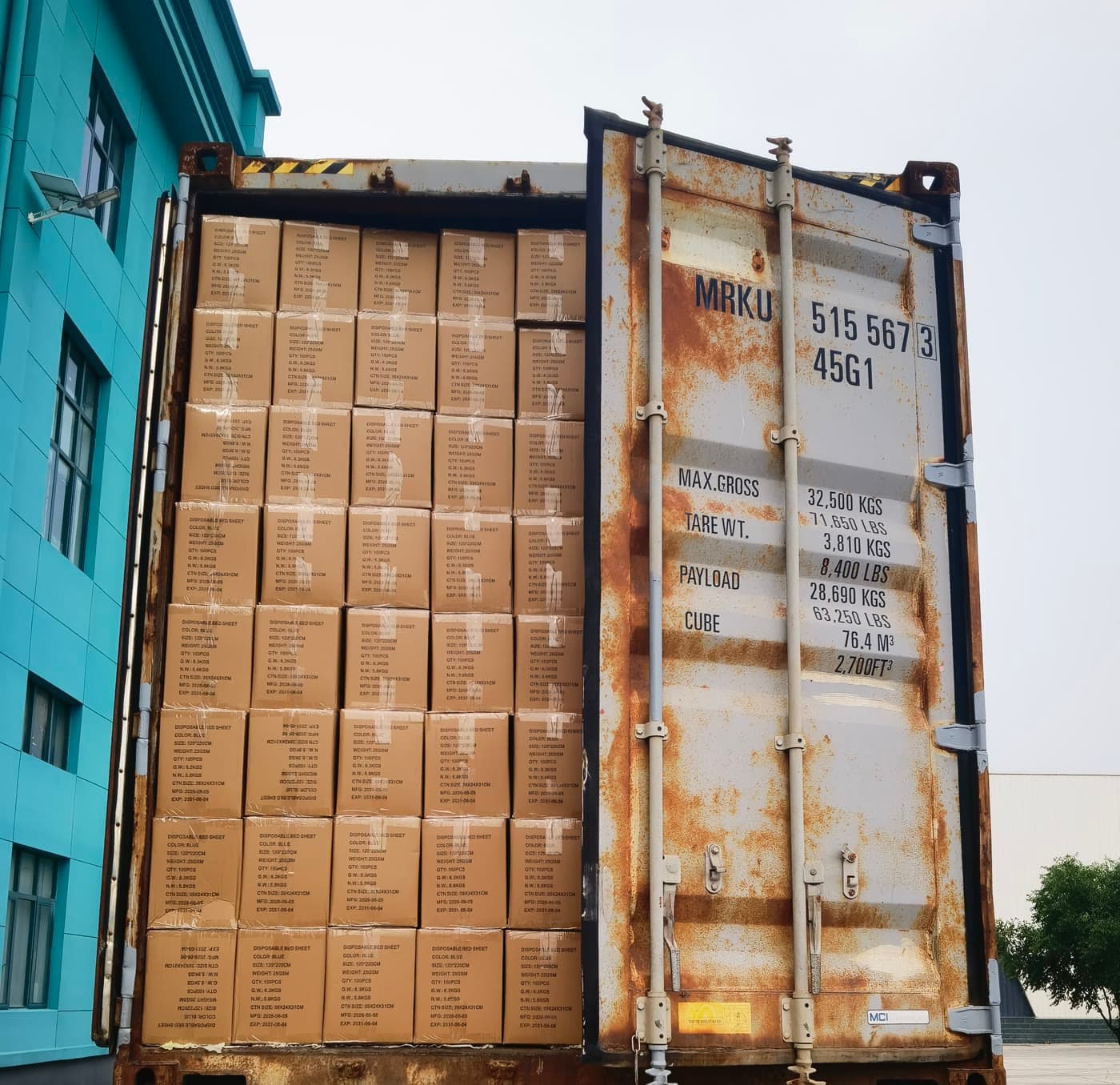 A grey container filled with cartons of medical supplies