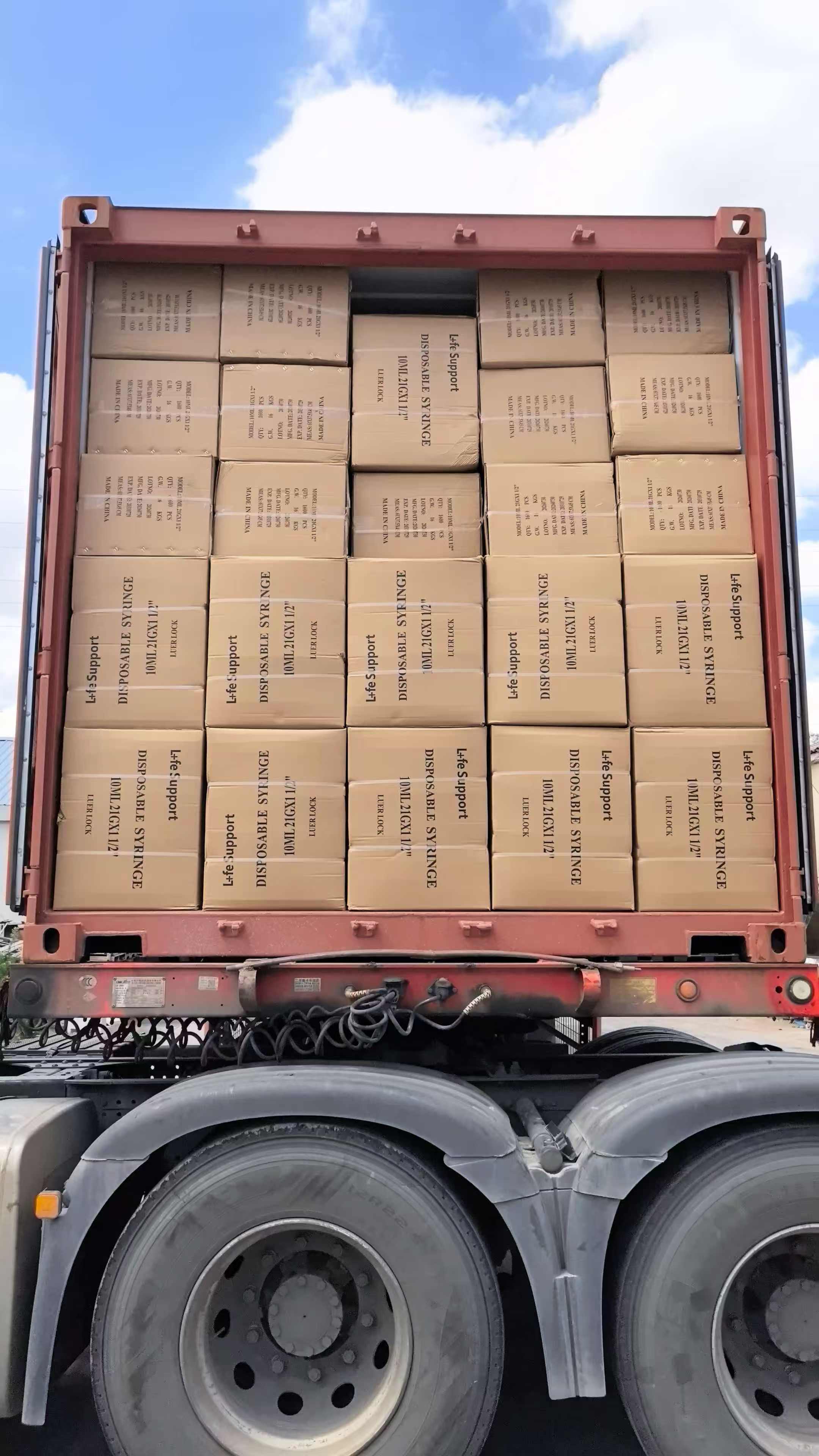 Loaded freight container carrying boxed medical equipment and supplies