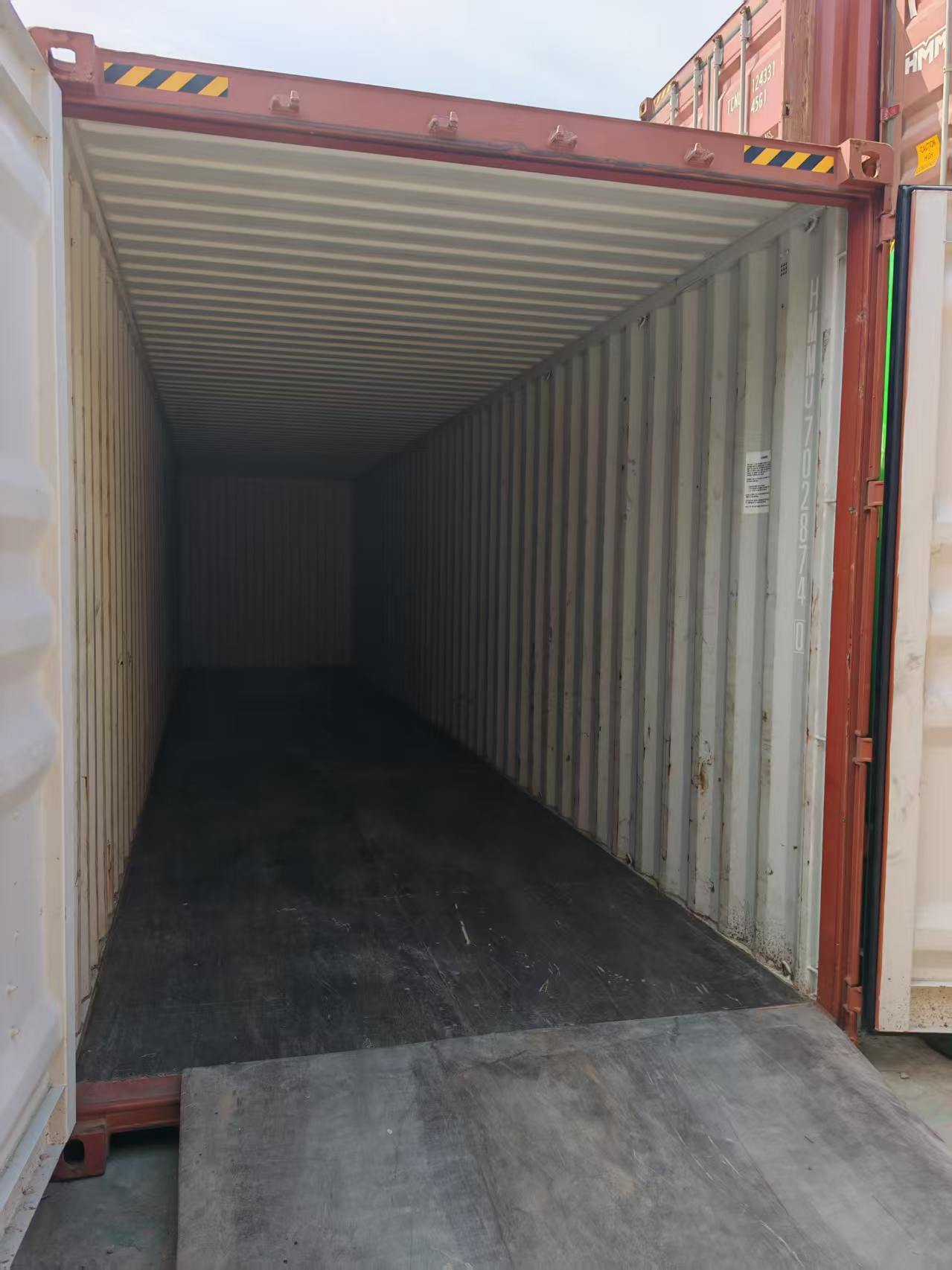 Empty export container with doors open, ready before loading begins